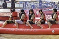 People riding on a banana boat in bali beach Royalty Free Stock Photo