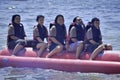 People riding on a banana boat in bali beach Royalty Free Stock Photo