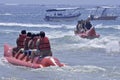 People riding on a banana boat in bali beach Royalty Free Stock Photo