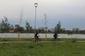 people riding bicycles in the city park Royalty Free Stock Photo