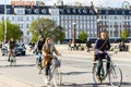 People riding bicycles in Copenhagen, Denmark. Street style Royalty Free Stock Photo