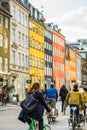 People riding bicycles Copenhagen old town, Denmark. Street style Royalty Free Stock Photo