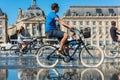 People riding bicycles in the fountain in Bordeaux, France Royalty Free Stock Photo
