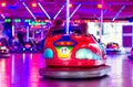 People riding bumper cars at  at the fair Royalty Free Stock Photo