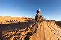 People riding camel in the Sahara desert, Morocco Royalty Free Stock Photo