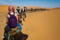 People riding camel in the Sahara desert, Morocco Royalty Free Stock Photo