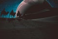 People are riding camels in a desert on a planet in the universe