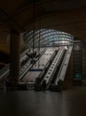 People riding the escalators inside of the Canary Wharf underground tube station Royalty Free Stock Photo