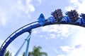 People riding face up, enjoying thrilling ride at high speed in Manta Ray Rollercoaster at Sea Royalty Free Stock Photo