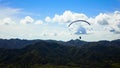 People riding and flying Paramotor flying in the sky mountains