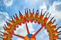 People riding with fun on extreme attraction in amusement park Royalty Free Stock Photo