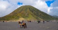 People Riding Horse At Mt Bromo Against Sky