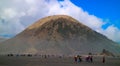 People Riding Horse At Mt Bromo Against Sky