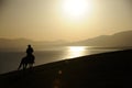 people riding horse at sunrise Royalty Free Stock Photo