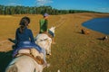 People riding horses in a rural landscape Royalty Free Stock Photo