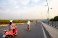 People riding Moto cycle on bridge in VietNam