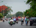 People riding motorbikes on street in Haiphong, Vietnam