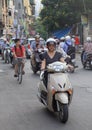 People are riding on motorcycles in Hanoi, Vietnam