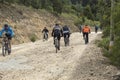 People riding mountain bicycle over a sand path road at bogota mountains