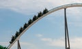 People riding Roller Coaster at an amusement theme park. Extreme fun Royalty Free Stock Photo