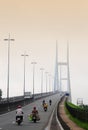 People riding scooters on the Mythuan bridge in Sadek, southern Vietnam