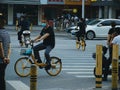 people riding shared bikes in Wuhan city