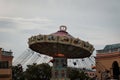 People riding swings at an amusement park