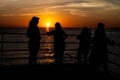 People on a river boat on Amazon river in Brazil watch a suns Royalty Free Stock Photo