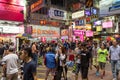 People at a road in Kowloon, Hong Kong at dark