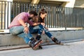 People on rollerblades sitting. Royalty Free Stock Photo