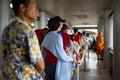 People in row waiting for boat on the pier Royalty Free Stock Photo