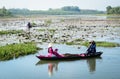 People rowing boat on the lotus lake