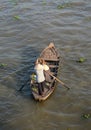 People rowing boat on river in An Giang, Vietnam