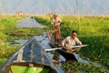 People on rowing a boat at the village of Maing Thauk