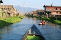 People rowing a boat at the village of Maing Thauk on lake Inle