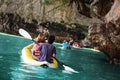 People rowing canoe in the sea