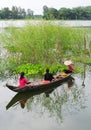 People rowing the wooden boat on lake in Phuyen, Vietnam