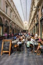 People in the Royal Galleries of Saint-Hubert in Brussels. Opened in 1847, it is one of the oldest shopping galleries in Europe. Royalty Free Stock Photo