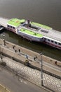 People running along steamboat Vysehrad - one of the last two remaining operating steamboats floating on Vltava River on March 3,