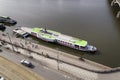 People running along steamboat Vysehrad - one of the last two remaining operating steamboats floating on Vltava River on March 3,