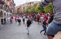 People running from the bulls during the Bull Runs festivities Navarre, Spain.