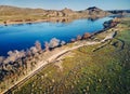 People running at country road near river aerial landscape Royalty Free Stock Photo