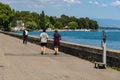 People Running at Embankment of Geneva Lake