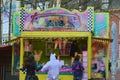 People running towards a cotton candy / popcorn stand Royalty Free Stock Photo