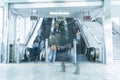 People rush on a escalator motion blurred Royalty Free Stock Photo