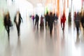 People Rushing at Airport in Motion Blur Royalty Free Stock Photo