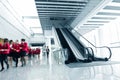 People rushing on escalator