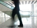 People rushing on escalator