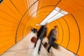 People rushing through a subway corridor