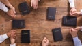 People`s Praying Hands On Holy Bible Royalty Free Stock Photo